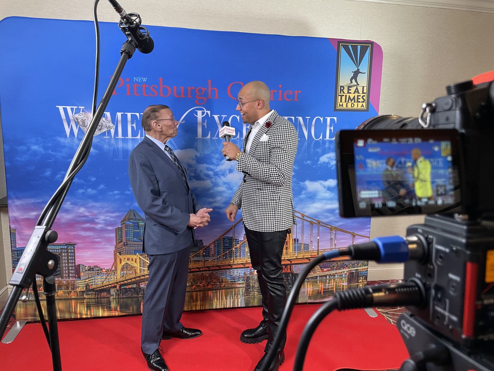 Two-camera interview setup on an event red carpet