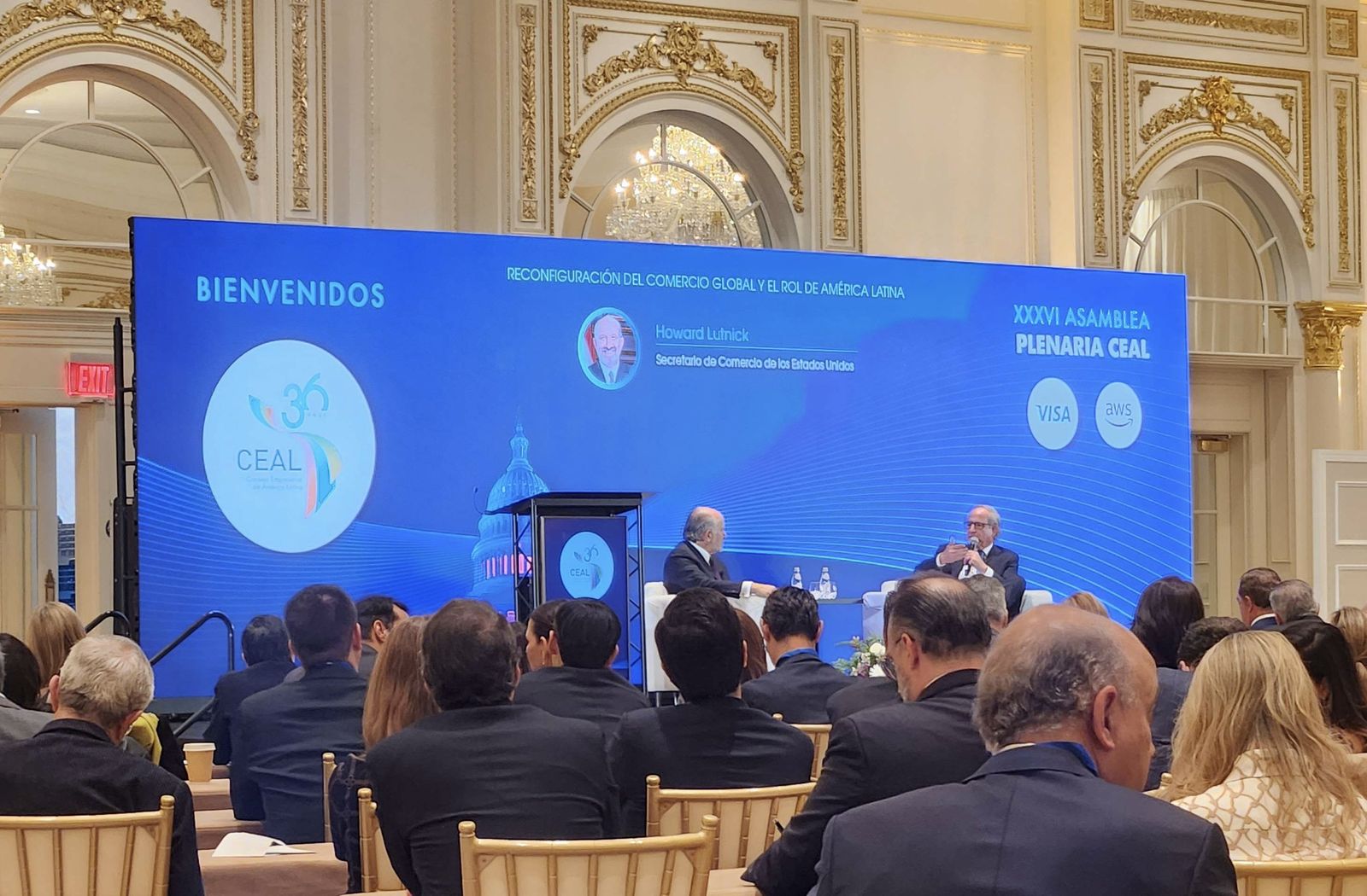 Plenary session production in an ornate ballroom